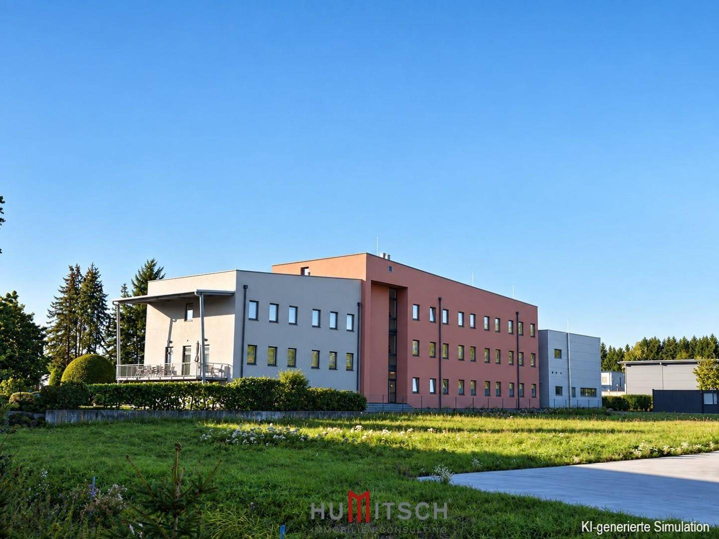 Weitläufige Ansicht des modernen Bürokomplexes mit weitläufigen Grünflächen und klarem Himmel.