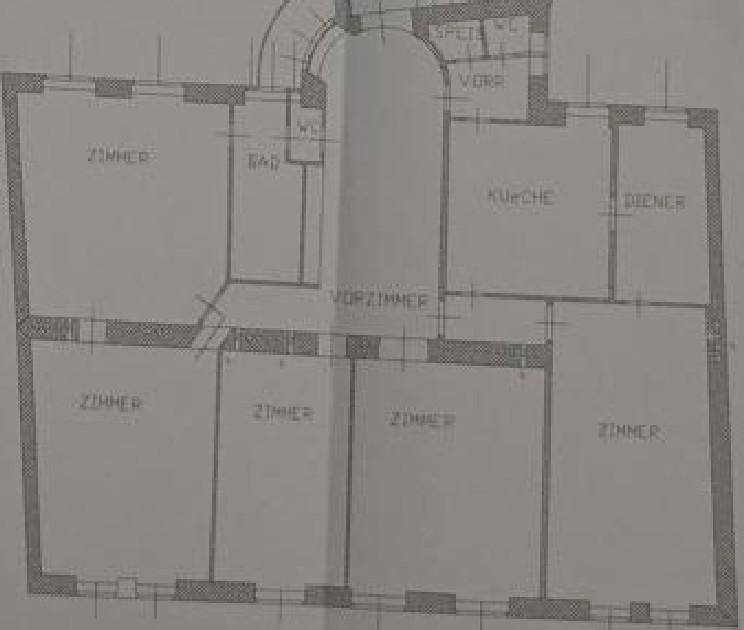 Grundriss einer Wohnung mit mehreren Zimmern, Bad, Küche und Vorzimmer, ideal zur Neuplanung.