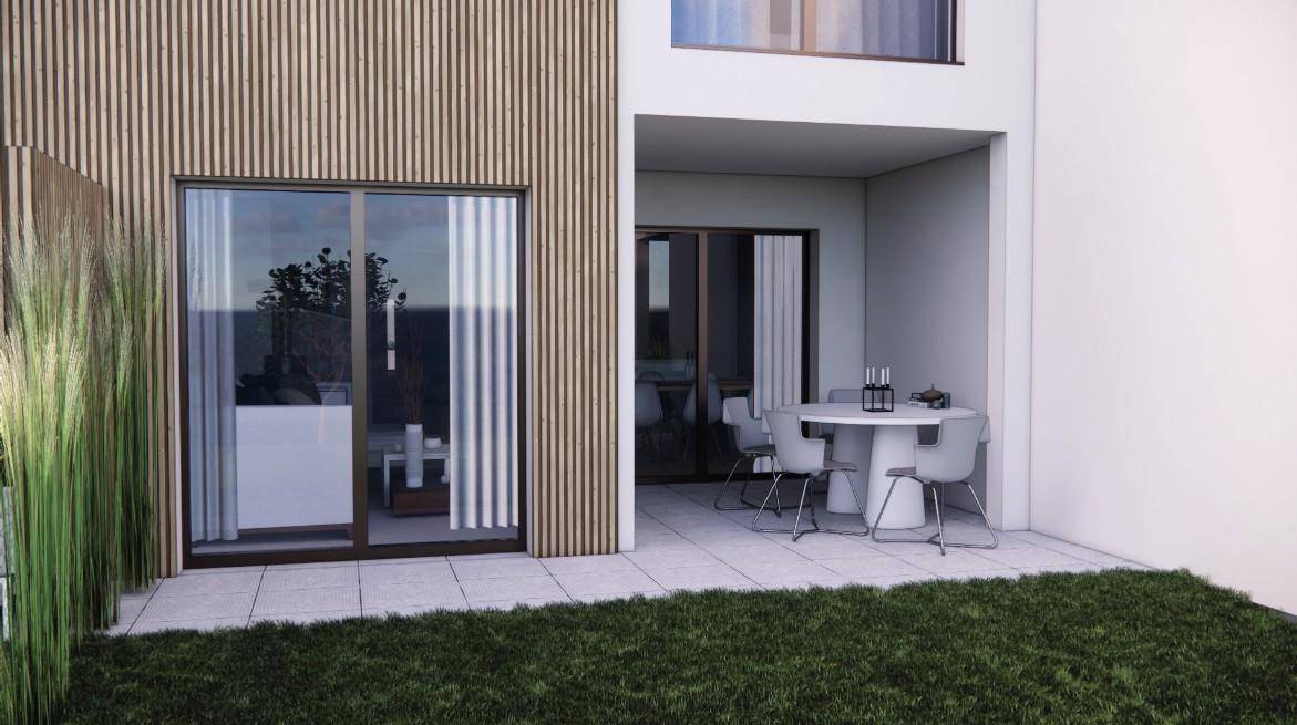 Gemütliche Terrasse mit modernen Gartenmöbeln und direktem Zugang zum Gartenbereich.