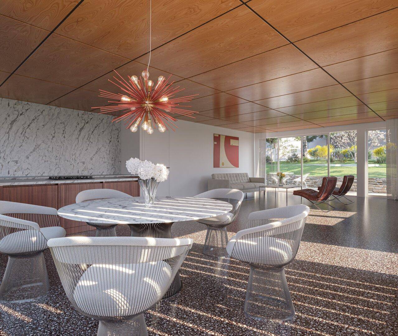 Eleganter Essbereich mit rundem Marmortisch und Designerstühlen, offen zum Wohnzimmer mit Blick ins Grüne.