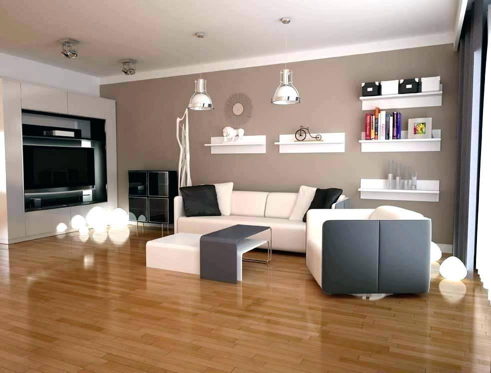 Modernes Wohnzimmer mit Holzboden, beiger Wand und minimalistischer Einrichtung.