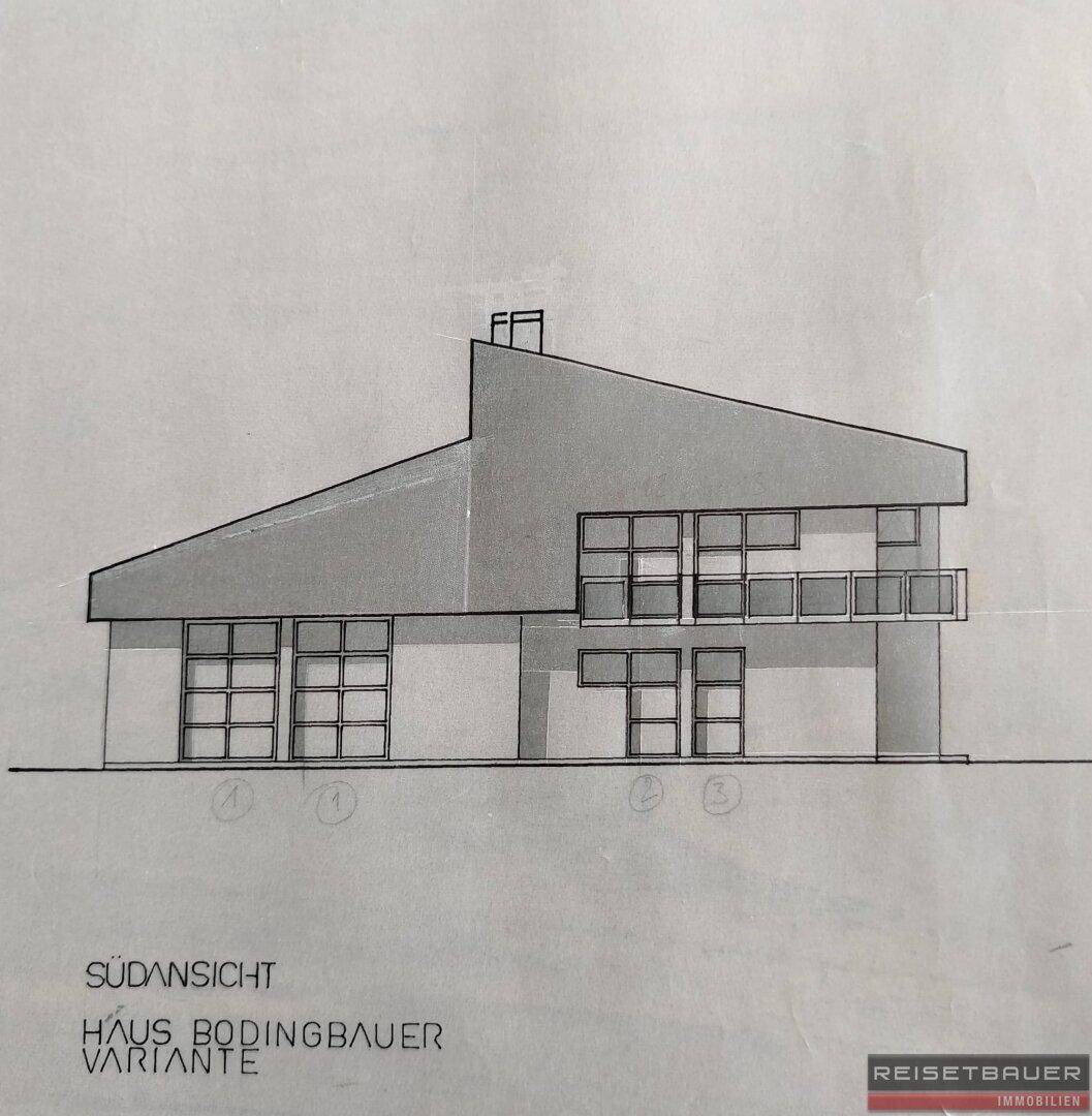 Südansicht des Hauses mit großen Fensterfronten und Balkonen, moderne Gestaltung.