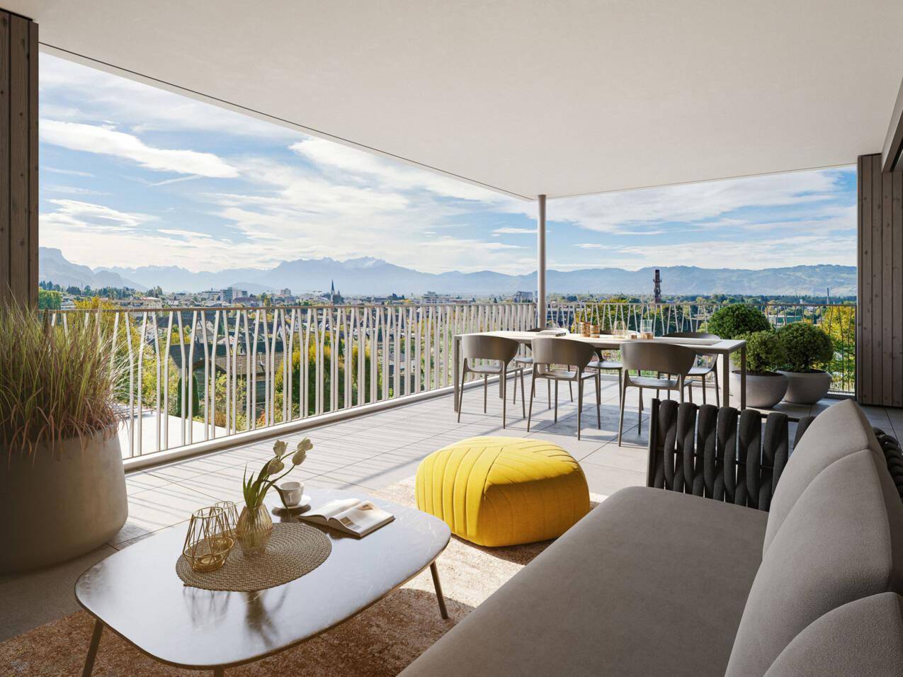 Geräumige, möblierte Terrasse mit weitem Blick auf die Berge und die Stadtlandschaft.