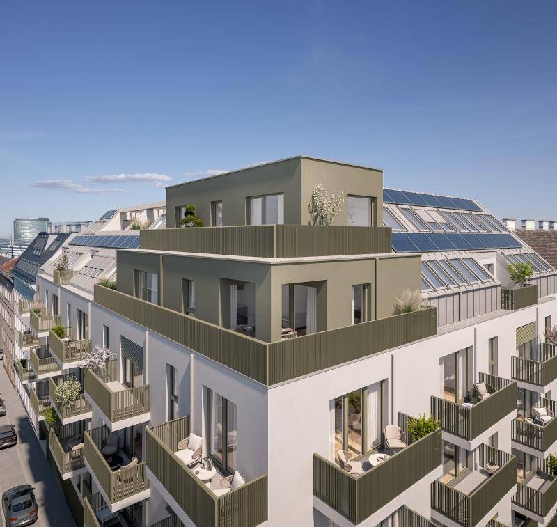 Ansicht eines modernen Apartmentgebäudes von oben mit Balkonen und Photovoltaikanlage auf dem Dach.
