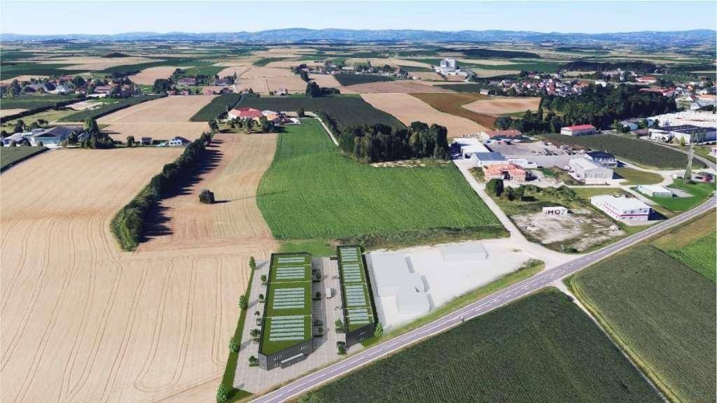 Luftaufnahme der Gewerbeimmobilien in ländlicher Umgebung mit Feldern, Straßen und umliegenden Ortschaften.