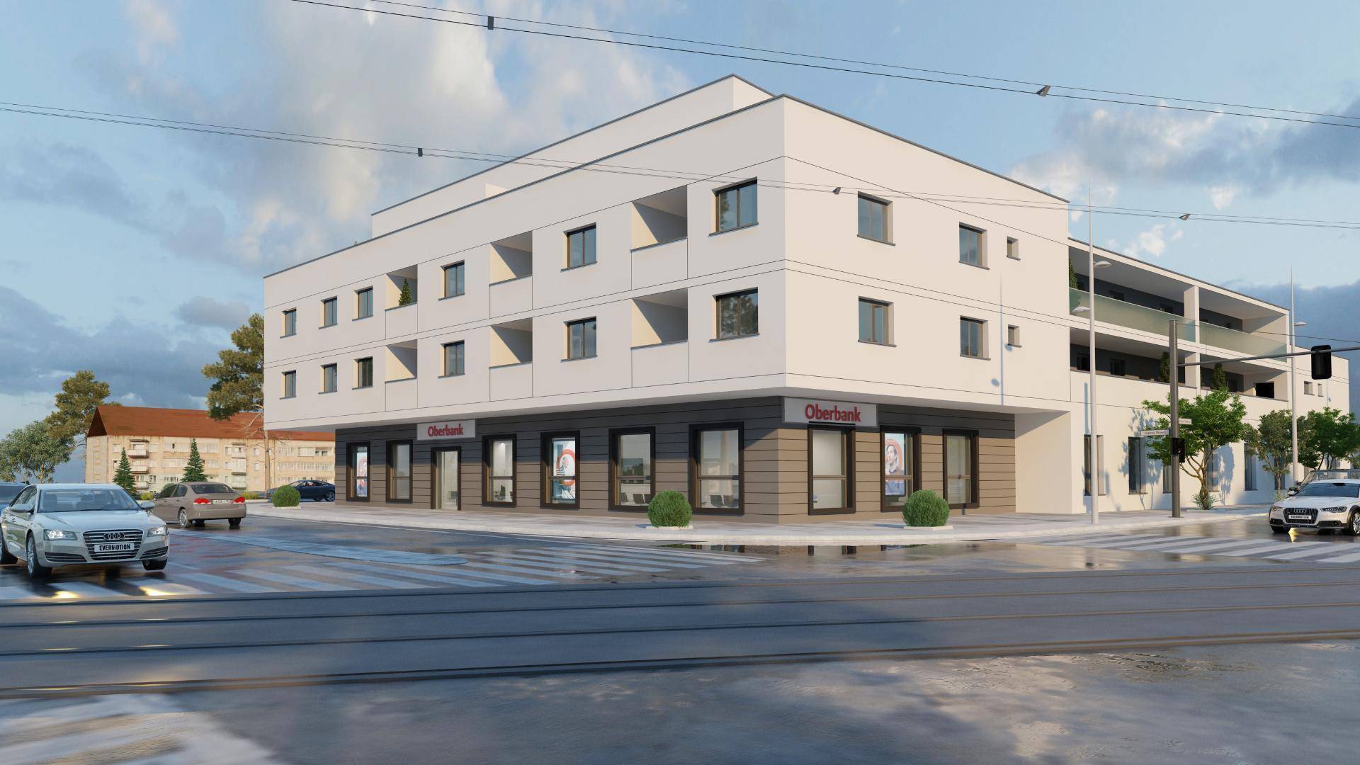 Moderne Gebäudefassade mit großen Fenstern und Geschäftsflächen im Erdgeschoss an einer Straße.