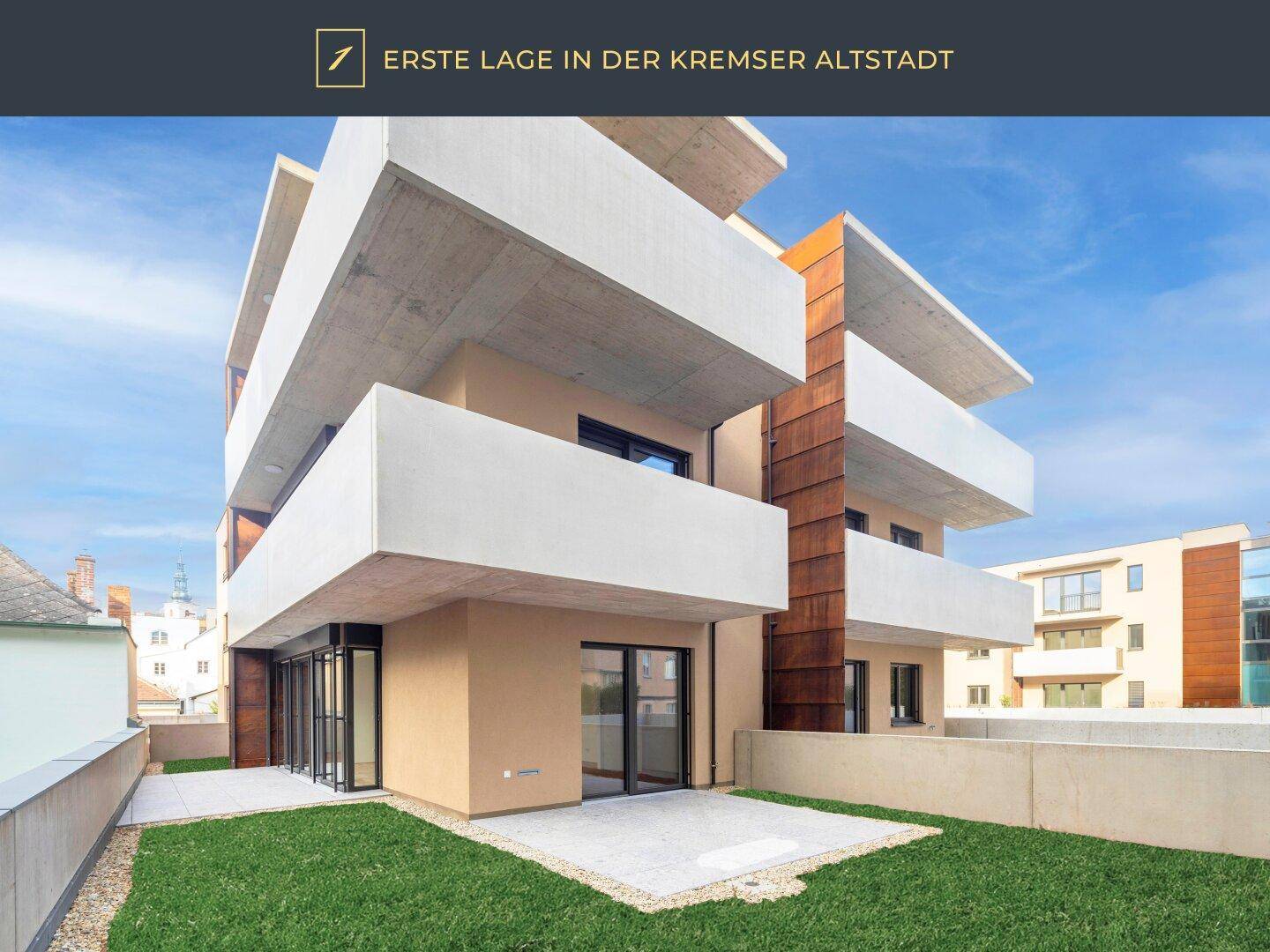 Moderne Erdgeschosswohnung mit privatem Gartenbereich und gepflasterter Terrasse.