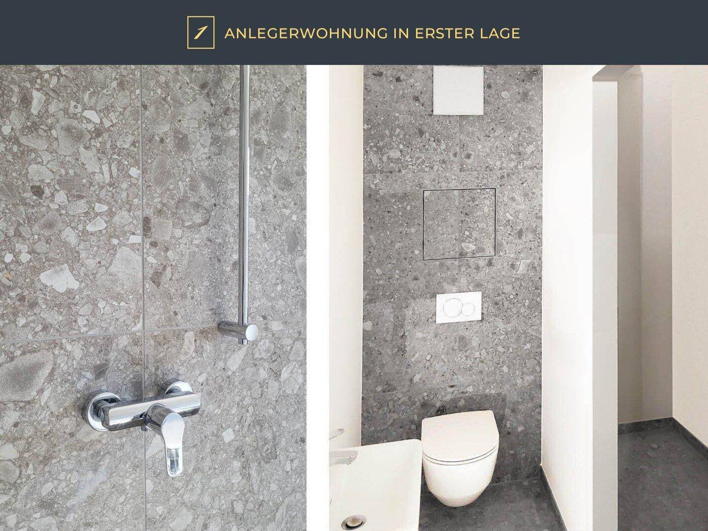 Modernes Badezimmer mit grauen Fliesen, wandhängendem WC und Duschbereich.