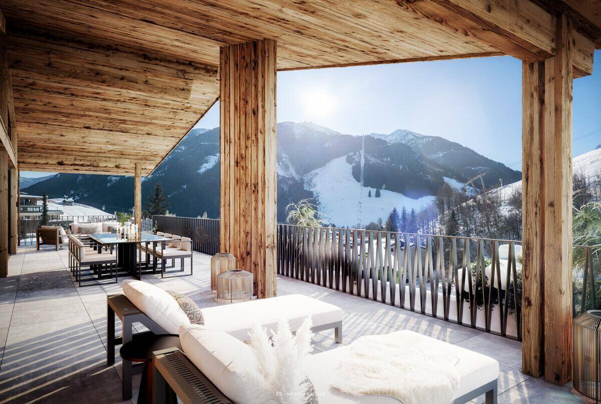Geräumige Holzterrasse mit Lounge-Möbeln und Essbereich, bietet einen weiten Blick auf die verschneiten Berge.