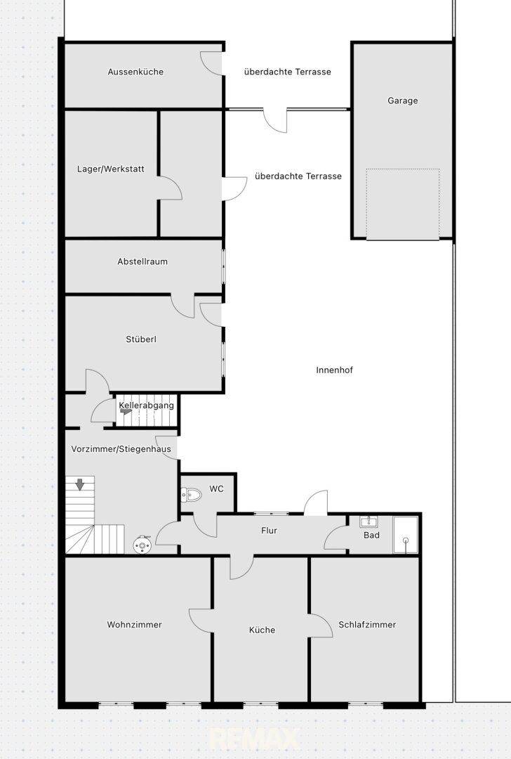 Grundriss des Erdgeschosses mit Wohnzimmer, Küche, Schlafzimmer, Bad und überdachten Terrassen.