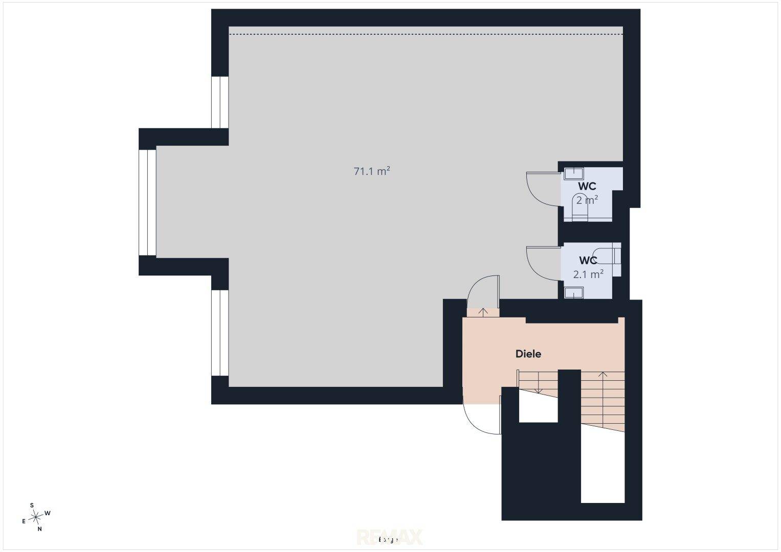 Grundrissplan zeigt einen großen Raum, zwei Toiletten und einen Eingangsbereich.