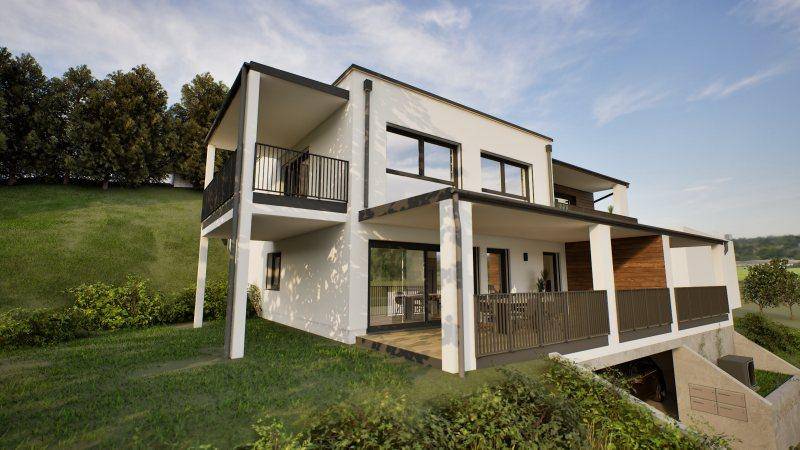 Seitenansicht der modernen Wohnanlage mit Terrassen und Balkonen, umgeben von viel Grün.