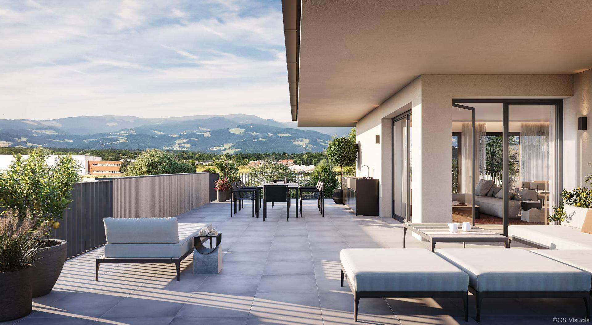 Großzügige Dachterrasse mit Essbereich, Lounge-Möbeln und atemberaubendem Bergblick.