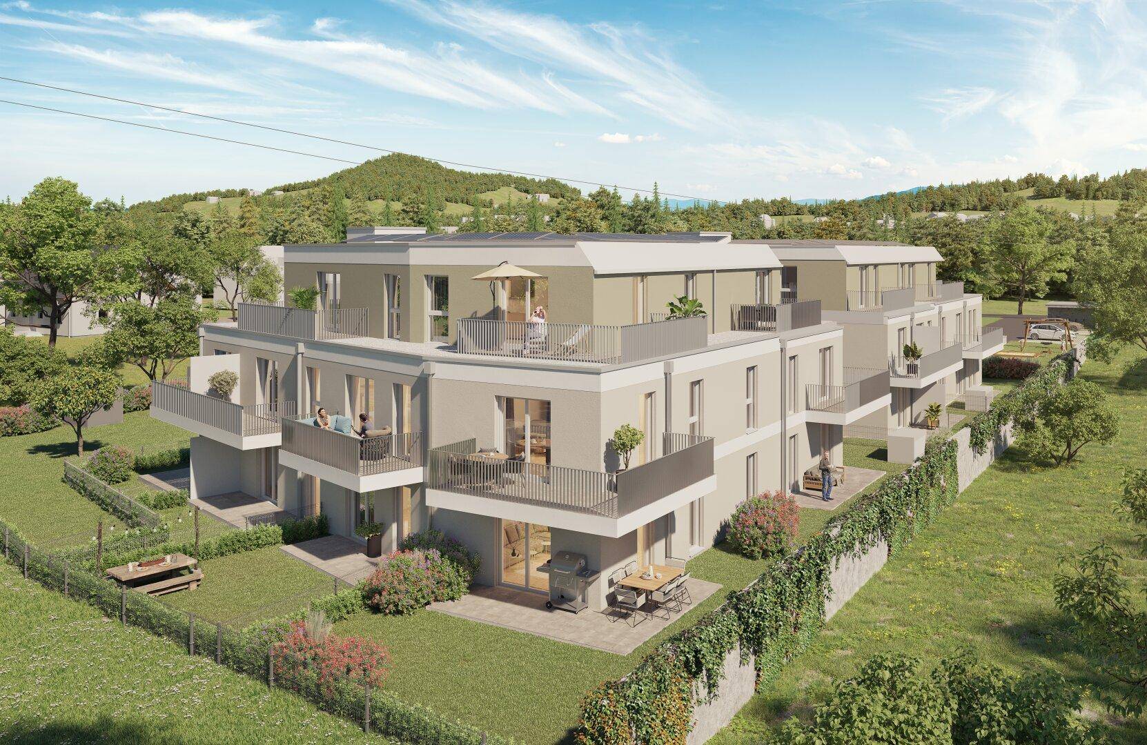 Moderne Wohnanlage mit Balkonen, Terrassen und grüner Umgebung in ländlicher Lage.