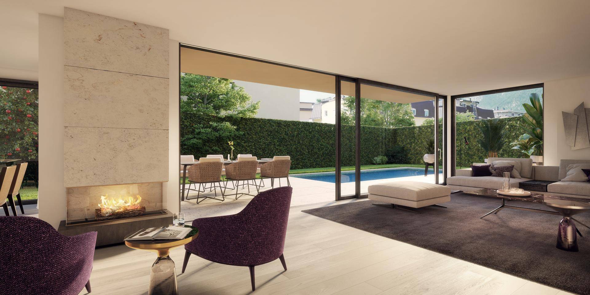 Helles Wohnzimmer mit Kamin, großen Glasfronten und direktem Zugang zum Poolbereich.