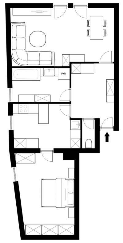Grundriss einer Wohnung mit Wohnbereich, Schlafzimmer und separater Küche.