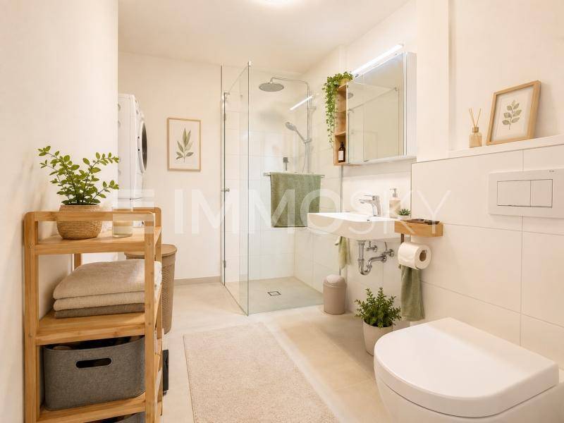 Modernes Badezimmer mit ebenerdiger Dusche, Waschbecken und integrierter Waschmaschine.