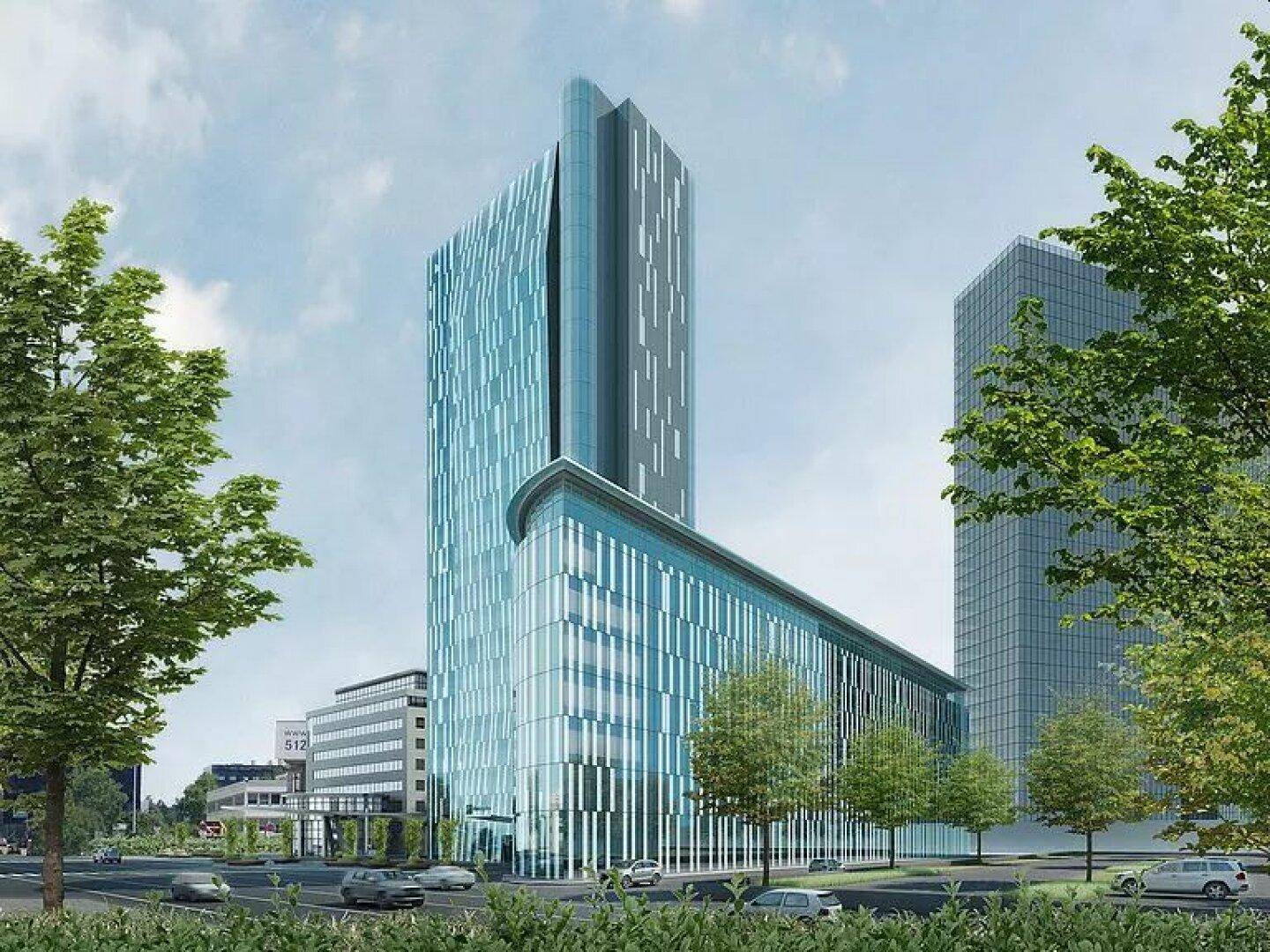 Moderne Hochhausarchitektur mit Glasfassade und schlanken Linien in einer städtischen Umgebung.