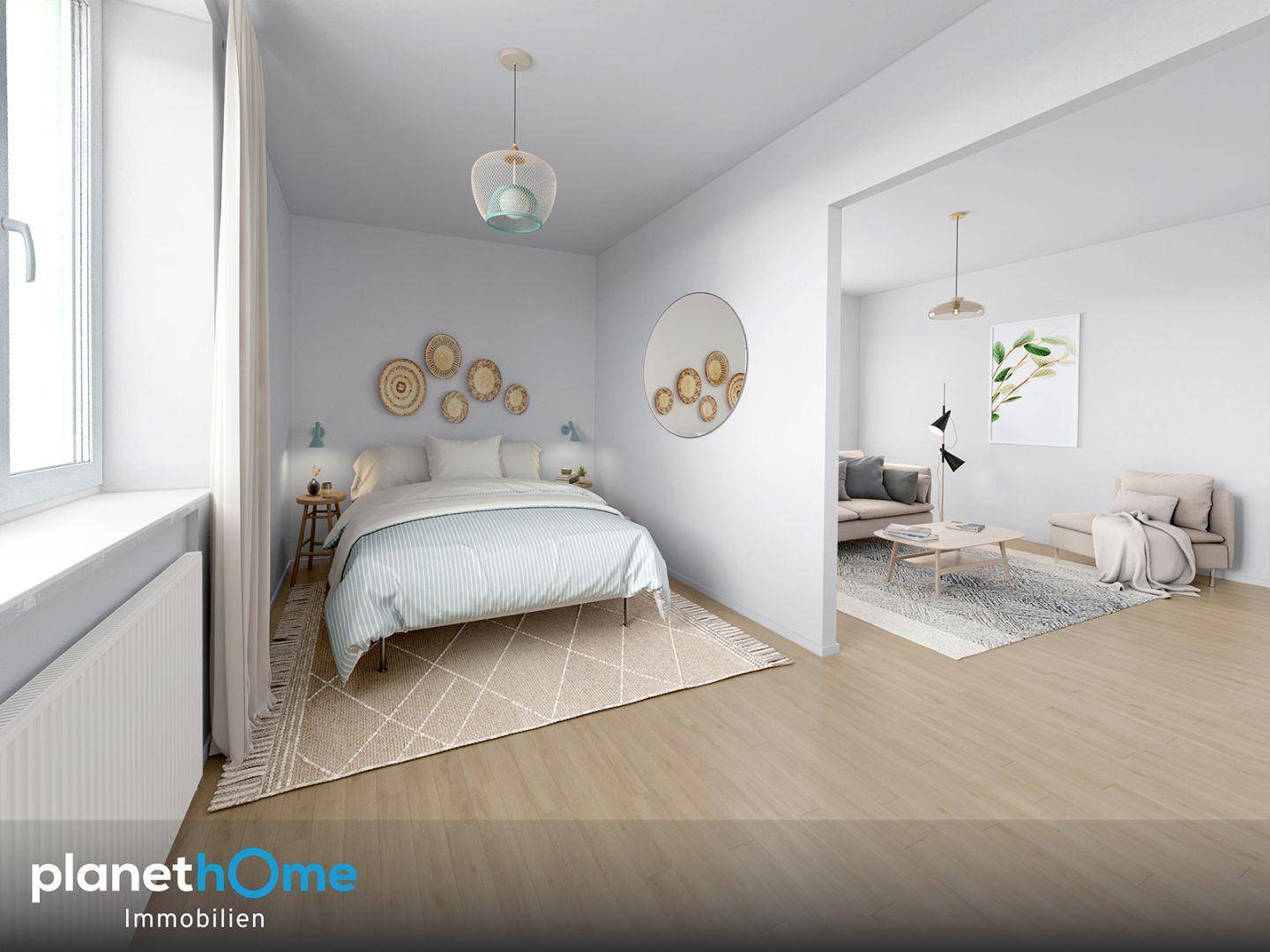 Helles Schlafzimmer mit modernem Bett und offenem Zugang zum angrenzenden Wohnbereich.