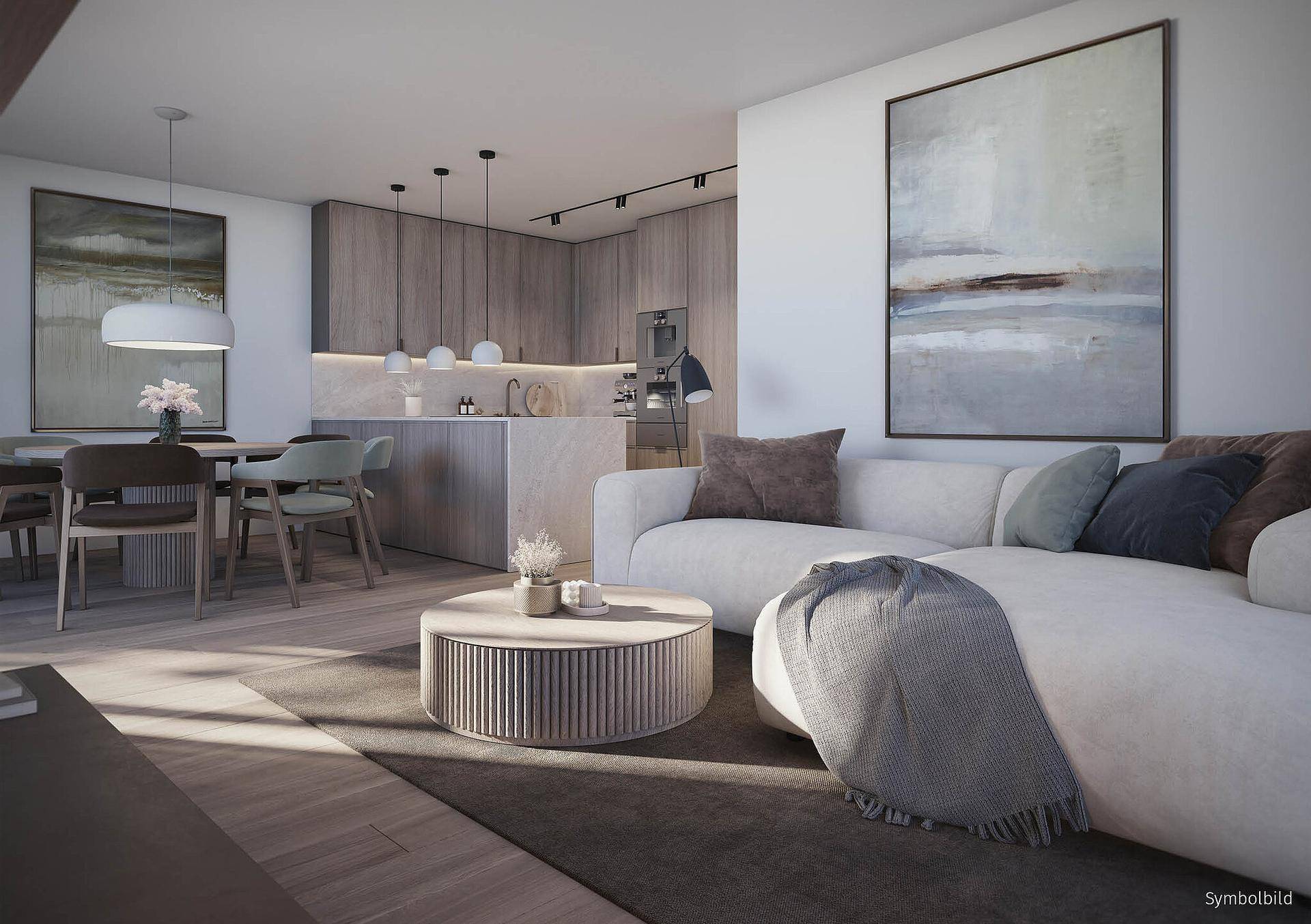Moderne offene Wohnküche mit Essbereich, bequemer Couch und stilvoller Einrichtung.
