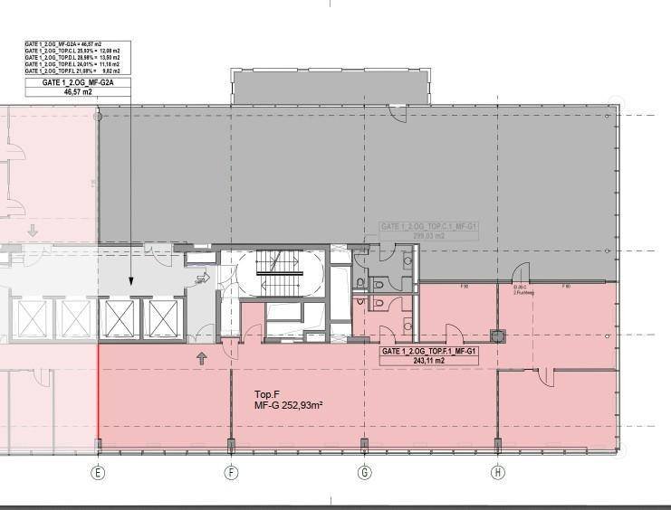 Dieser Grundriss zeigt eine offene Bürofläche mit Aufzug und Treppenhaus sowie mehreren Toilettenbereichen.