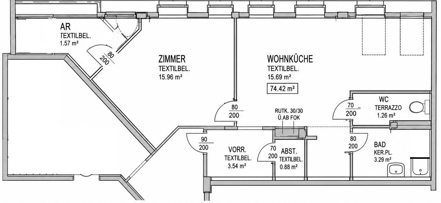 Grundriss einer Wohnung mit Wohnküche, Zimmer, Bad und WC.