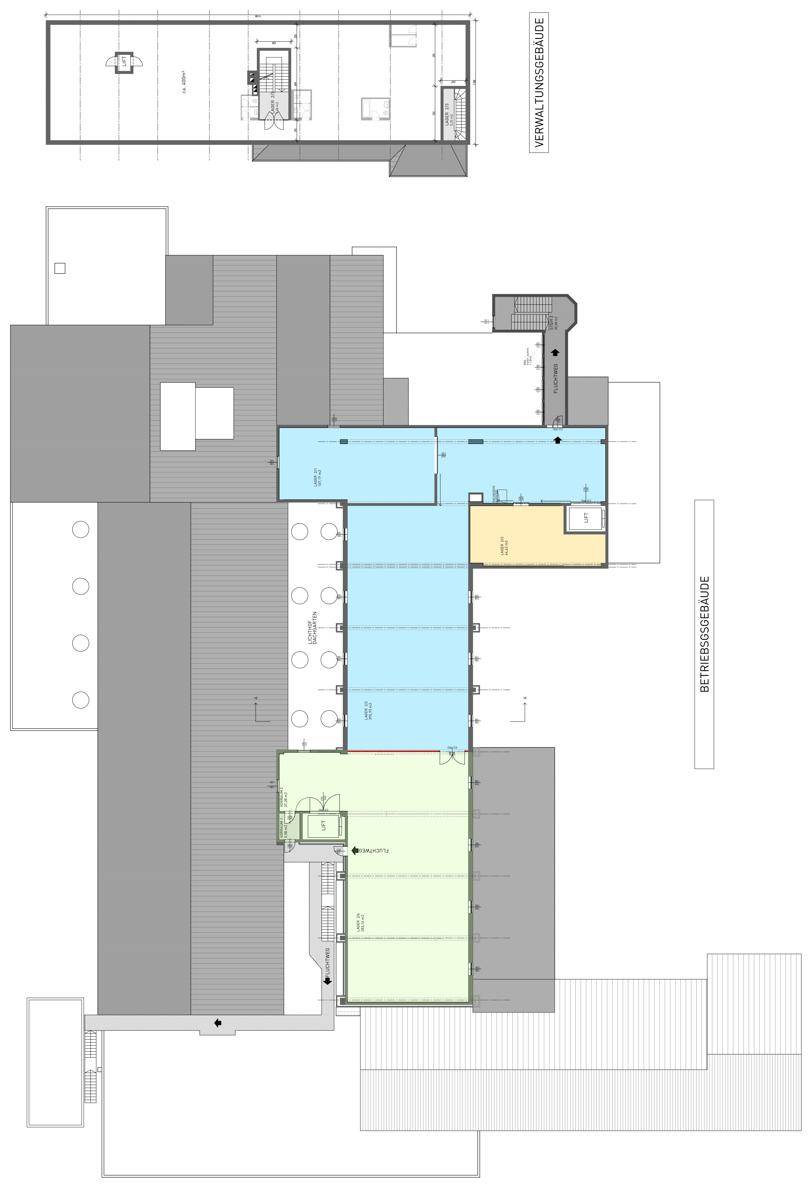 Strukturierter Grundriss des Gebäudekomplexes mit farbigen Bereichen und klarer Raumgliederung.
