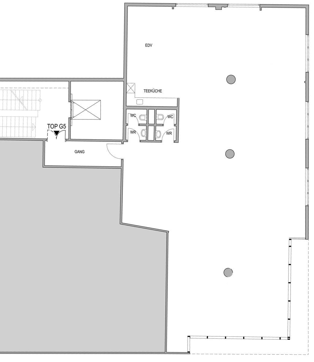 Grundrissplan einer Gewerbefläche mit Teeküche, Toiletten und großem offenen Bereich.