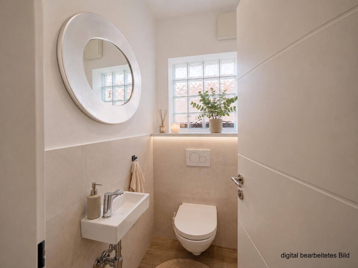Stilvolles Gäste-WC mit Wand-WC, kleinem Waschbecken und rundem Spiegel.