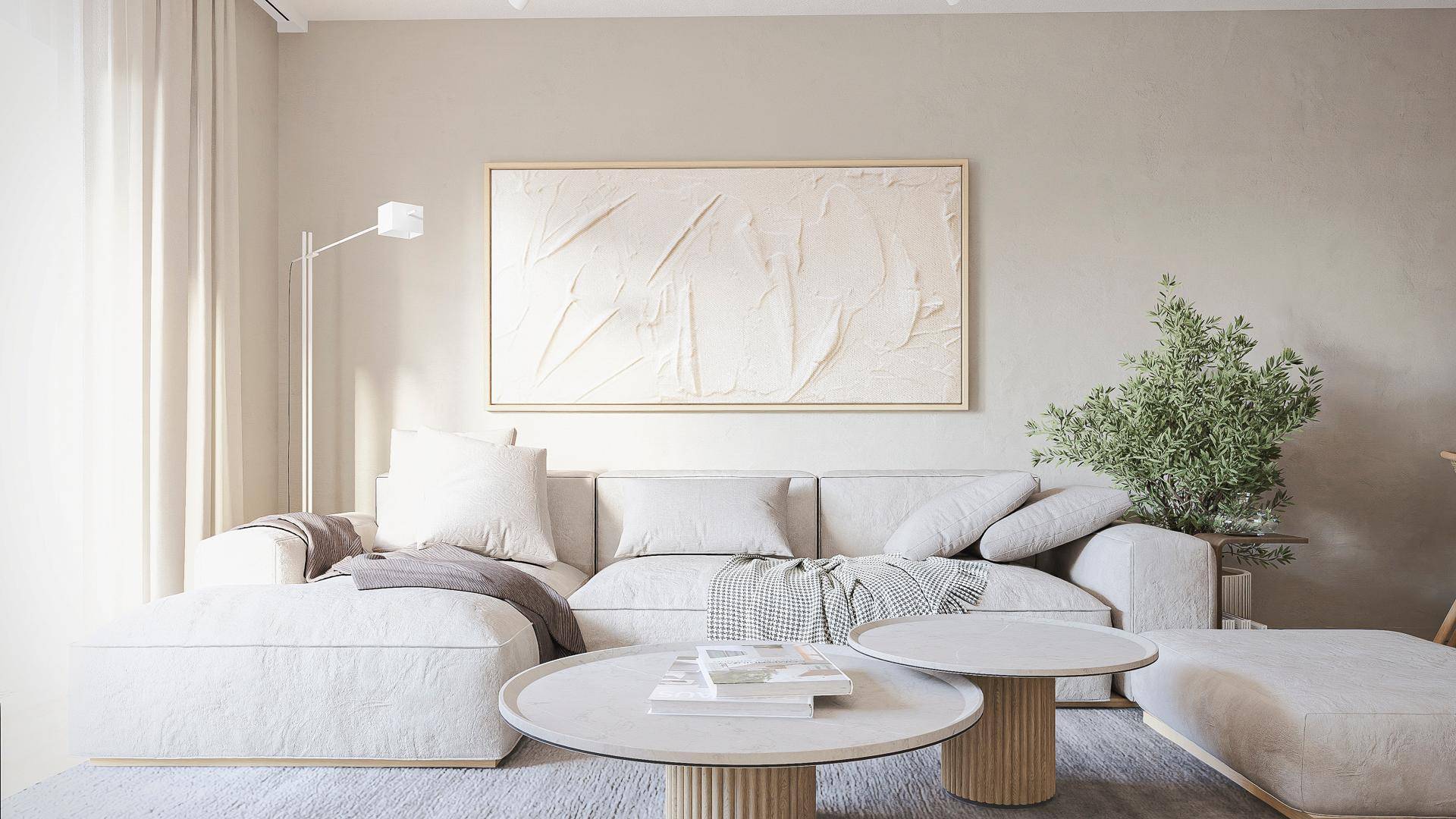 Gemütlicher Wohnbereich mit hellem Sofa, modernen Couchtischen und abstrakter Kunst an der Wand.