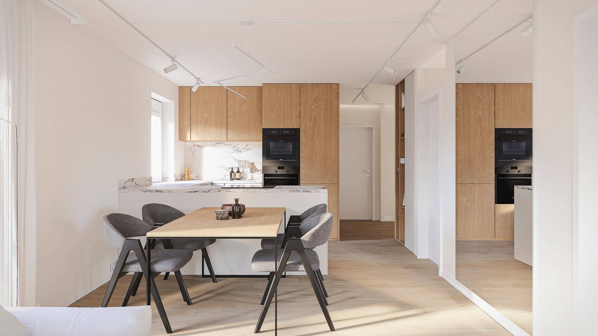 Moderne Küche mit hellen Holzfronten, Marmorarbeitsplatte und integriertem Essbereich.