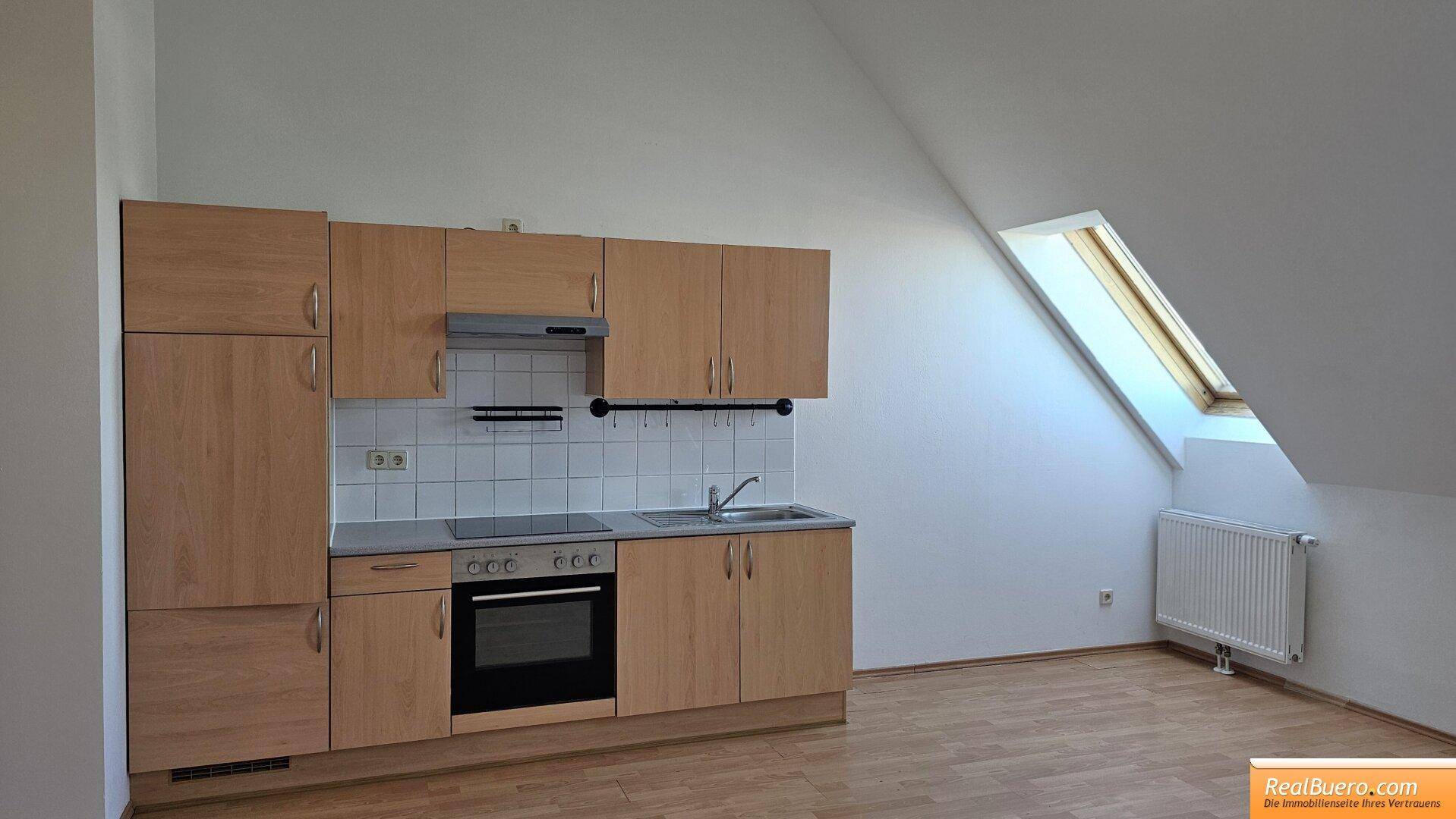 Wohnesszimmer mit Einbauküche