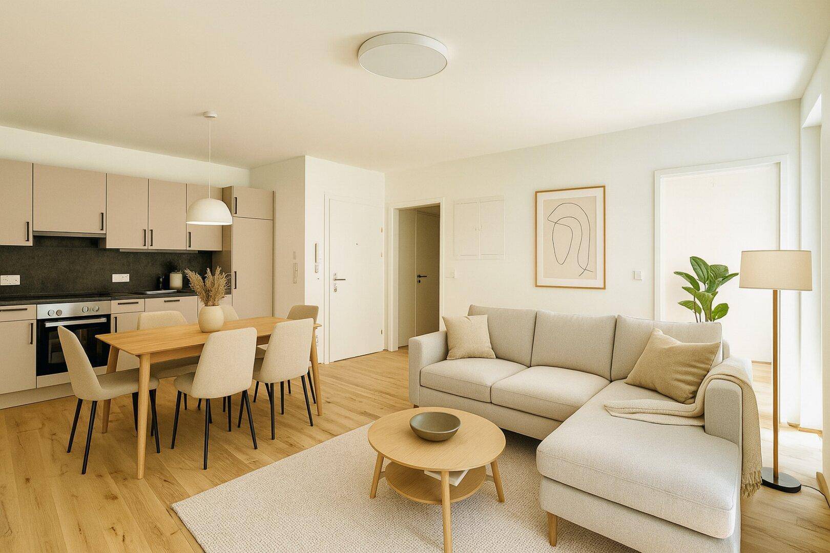 Geräumiger Wohnbereich mit beigem Sofa, Esstisch und moderner Einbauküche in hellem Ambiente.