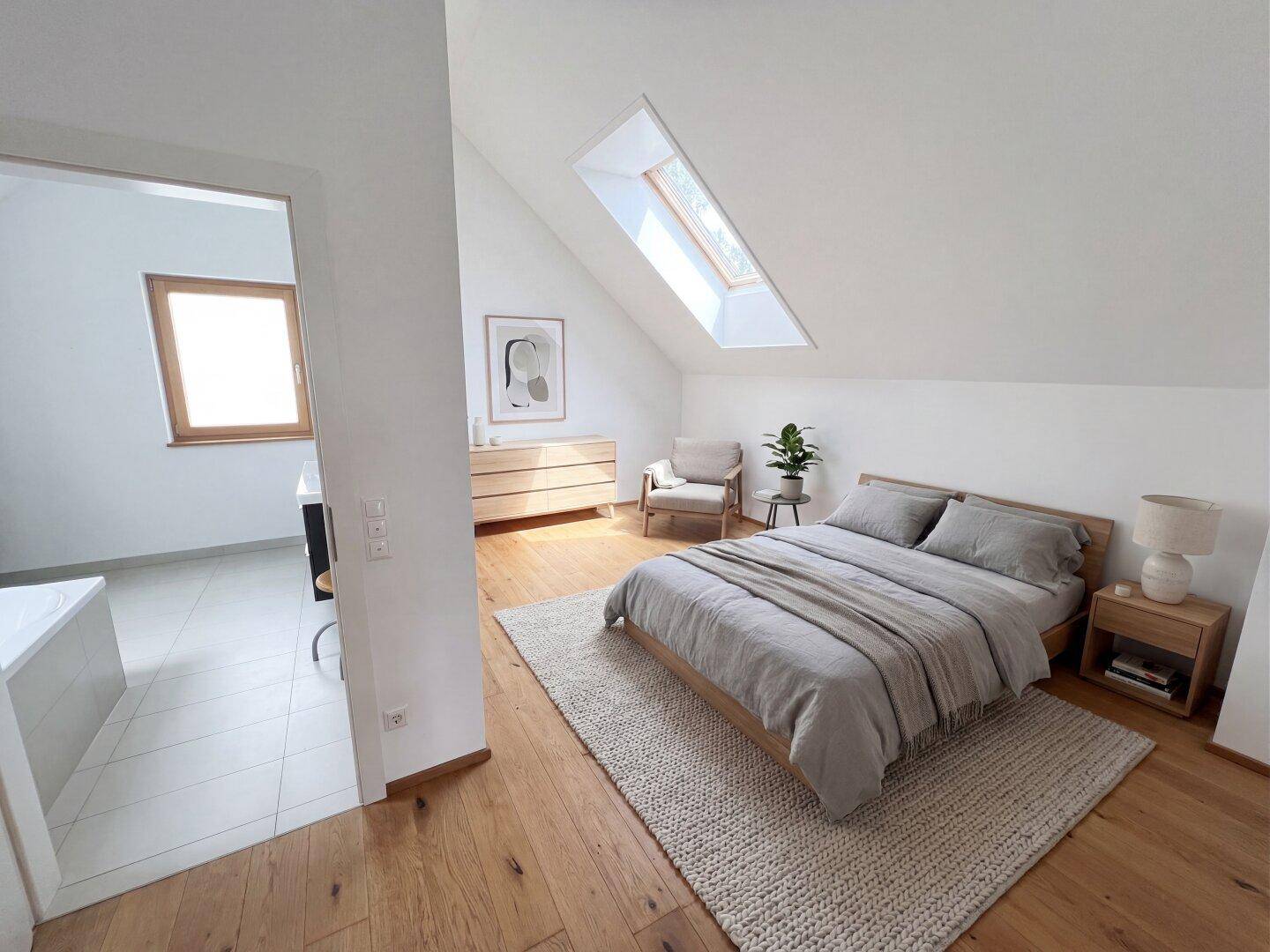 Gemütliches Schlafzimmer im Dachgeschoss mit Holzboden, Doppelbett und Dachfenster.