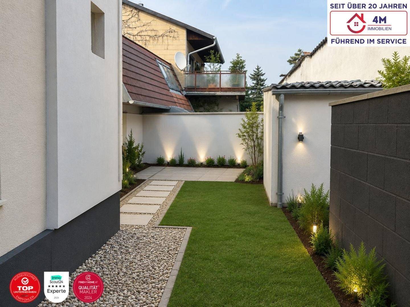 Neu gestalteter Gartenbereich mit Rasen, Kiesweg, Beleuchtung und gepflasterter Terrasse.