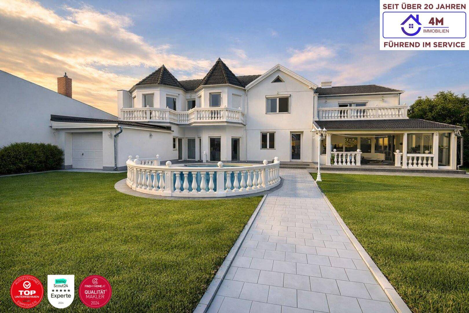 Prächtige Villa mit weitläufigem Garten, gepflegtem Rasen und elegantem Zugangsweg.