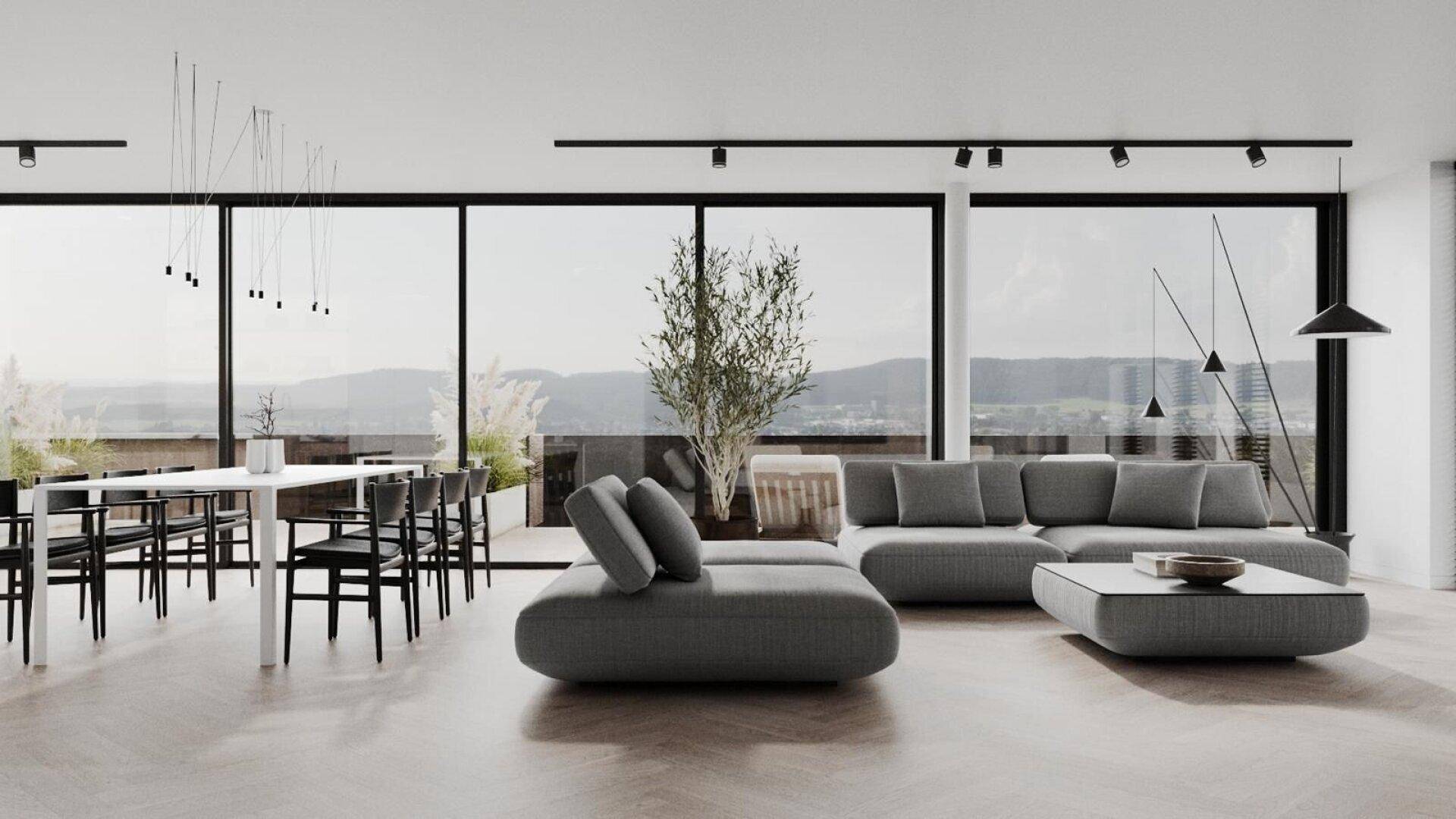 Heller, offener Wohn-Essbereich mit großen Fenstern, modernem Sofa und Holzboden.