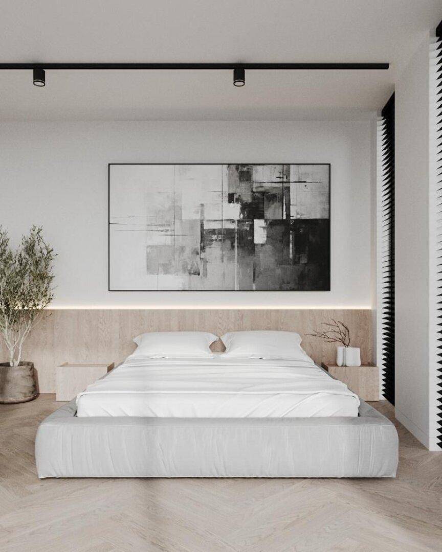 Schlafzimmer mit modernem Bett, Holzakzenten und minimalistischer Kunst an der Wand.