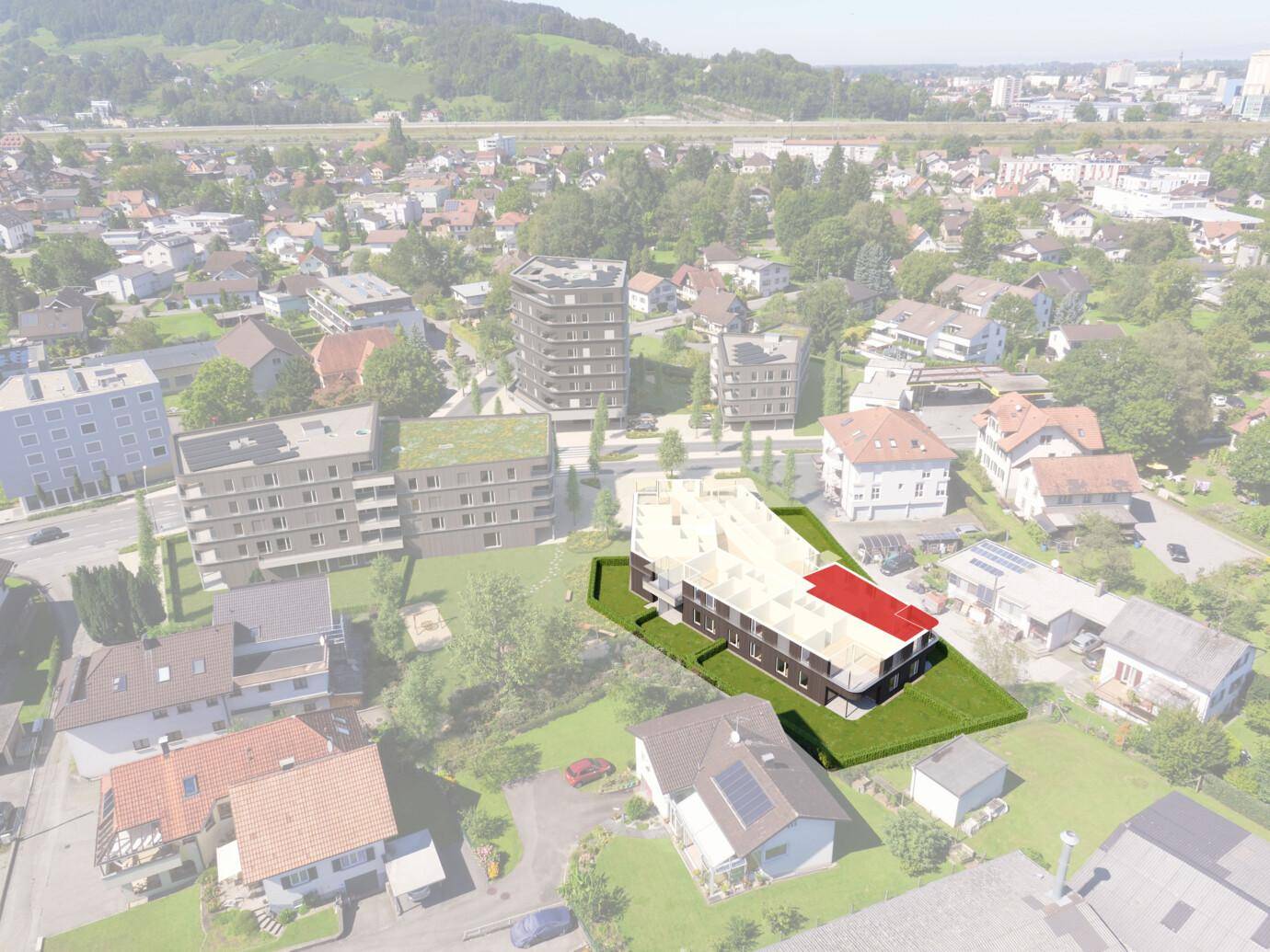 Luftaufnahme eines modernen Neubaus in einer grünen Wohngegend mit umliegenden Gebäuden.