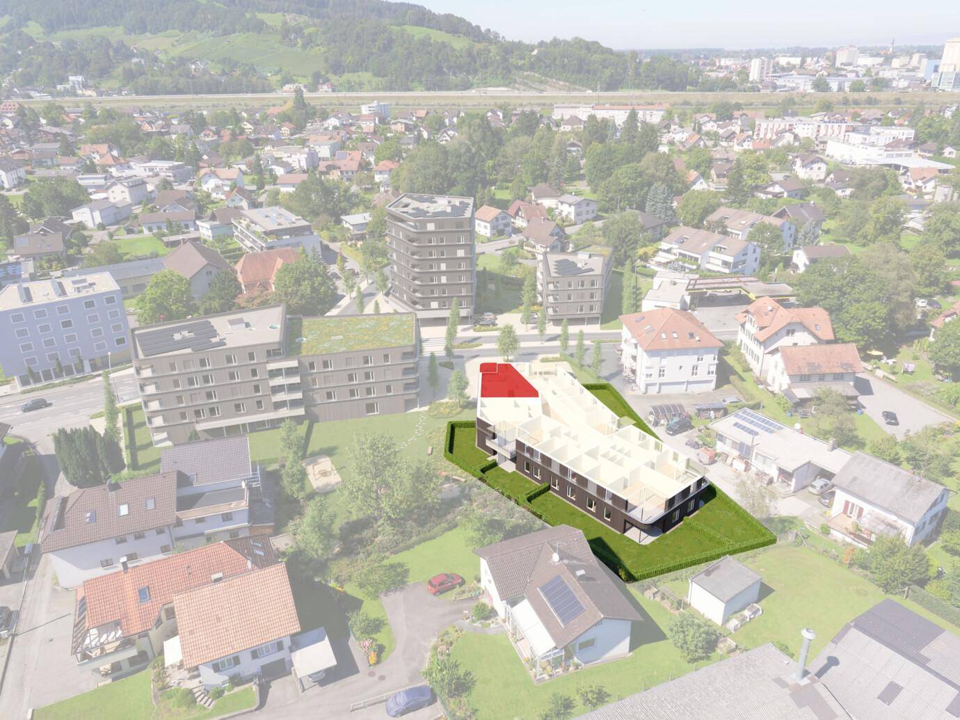 Luftaufnahme eines modernen Neubaus mit Flachdach und Balkonen in einer grünen Wohngegend.