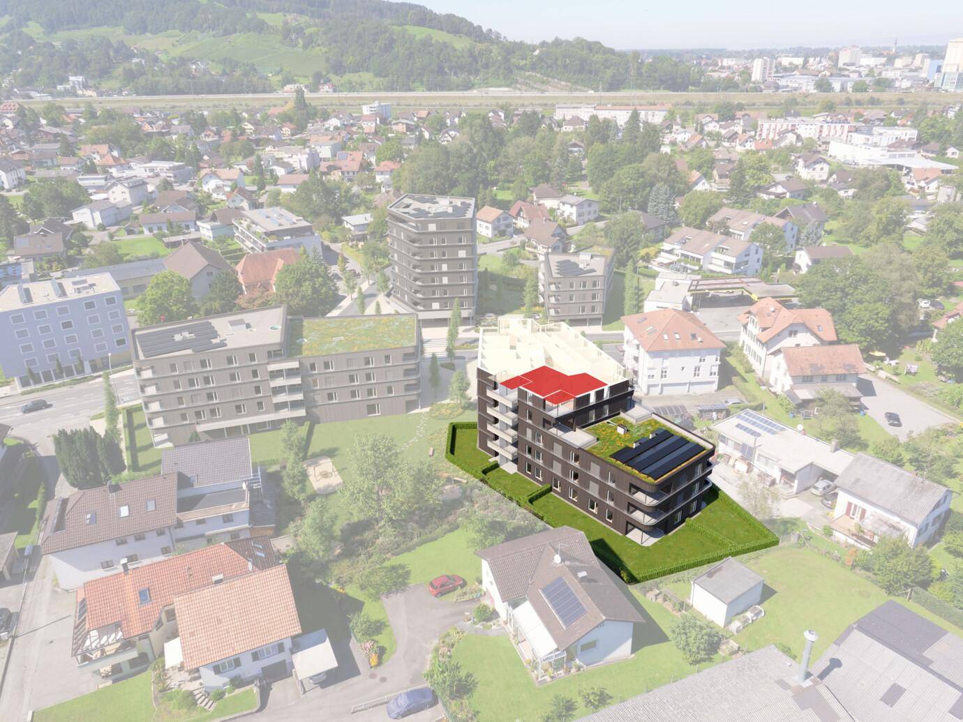 Visualisierung eines modernen Wohngebäudes Rheindorf W26 mit Begrünung und Solarmodulen auf dem Dach, umgeben von Häusern und einer Straße.