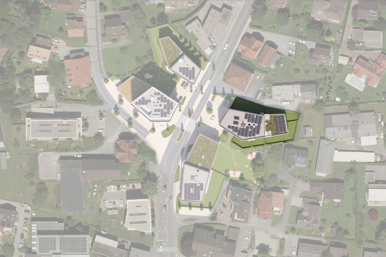 Rheindorf Gesamtansicht: Eine Draufsicht zeigt mehrere moderne Gebäude mit extensiven Gründächern und Photovoltaik-Anlagen, umgeben von Straßen und Grünflächen.