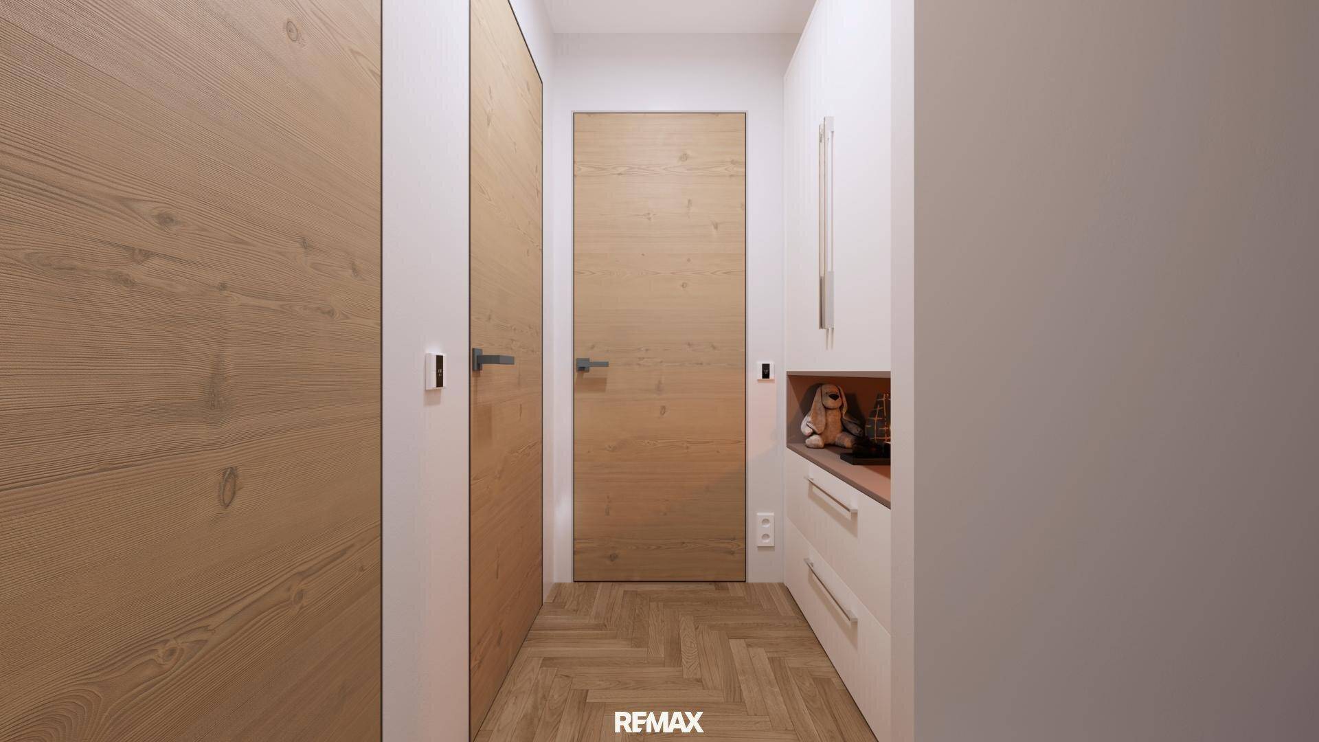 Heller Flur mit Holztüren und Fischgrätparkettboden in modernem Design.