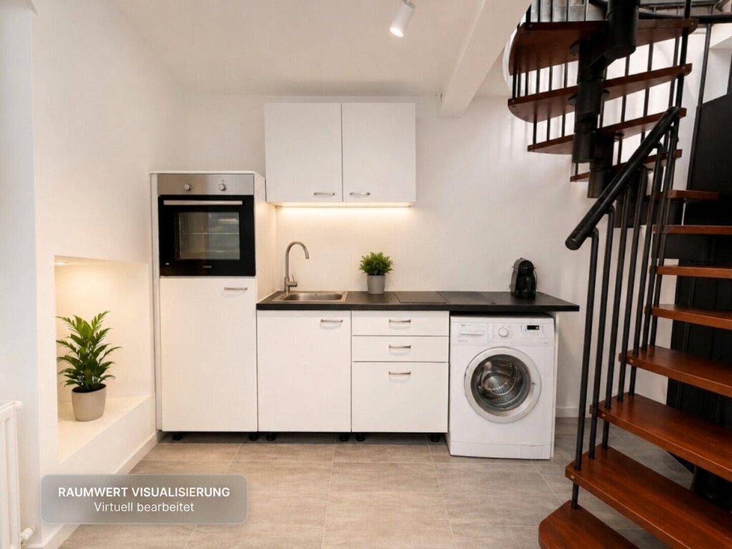Kleine Küchenzeile mit Backofen, Spüle und Waschmaschine unter einer Holztreppe.