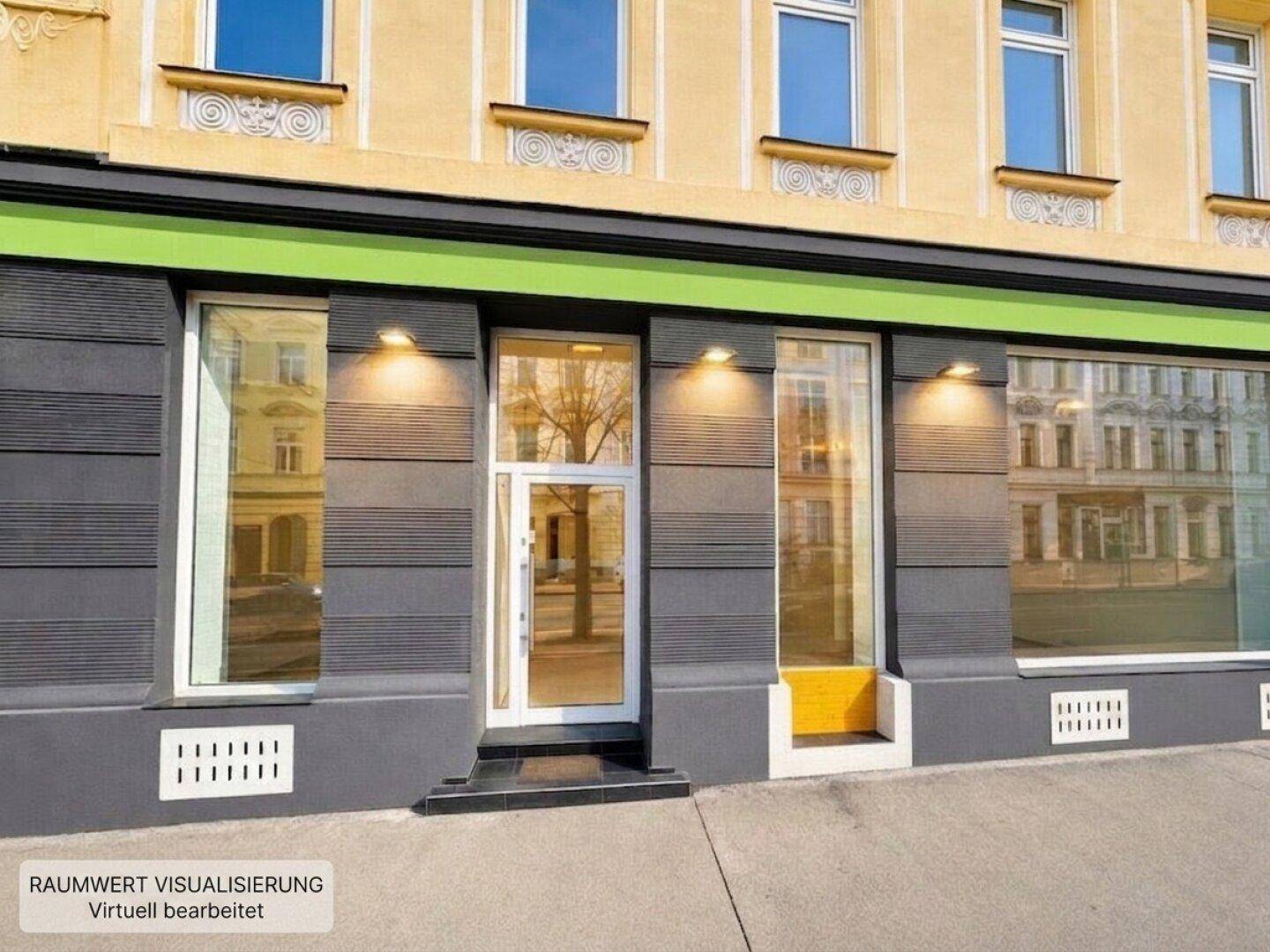 Moderne Geschäftsfassade mit großen Schaufenstern und einem hellen Eingangsbereich.