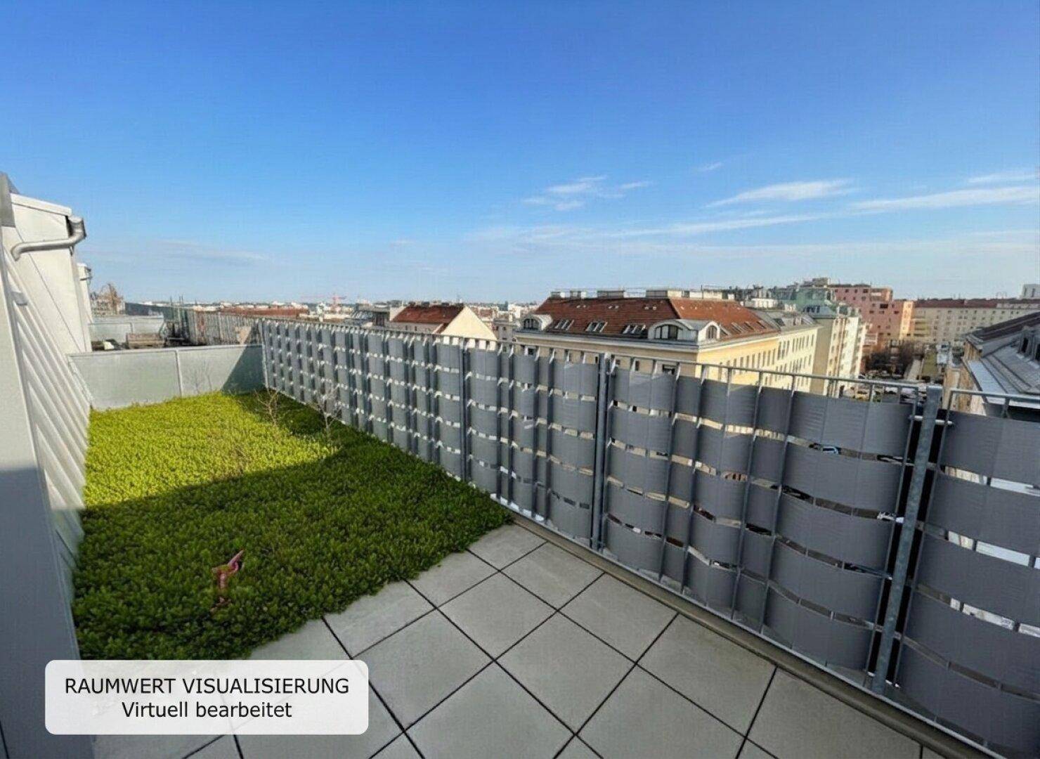 Dachterrasse mit Grünfläche und weitem Blick über die Dächer der Stadt.