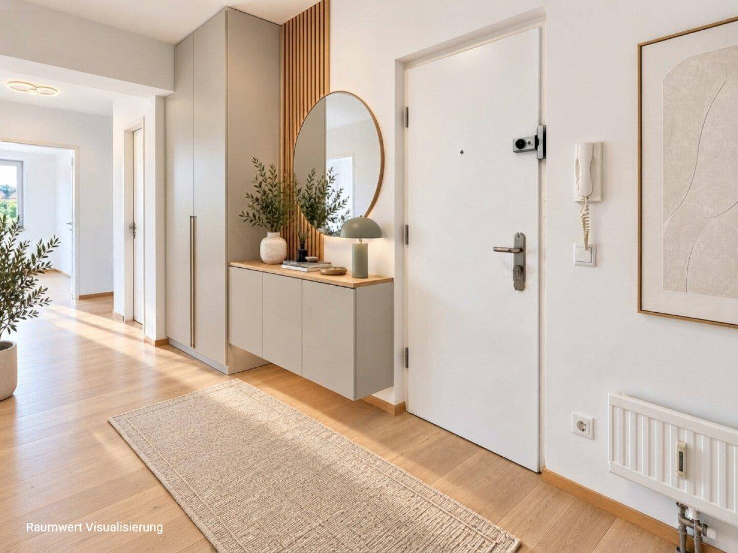 Heller Eingangsbereich mit Garderobenschrank, Spiegel, Konsole und Holzboden.
