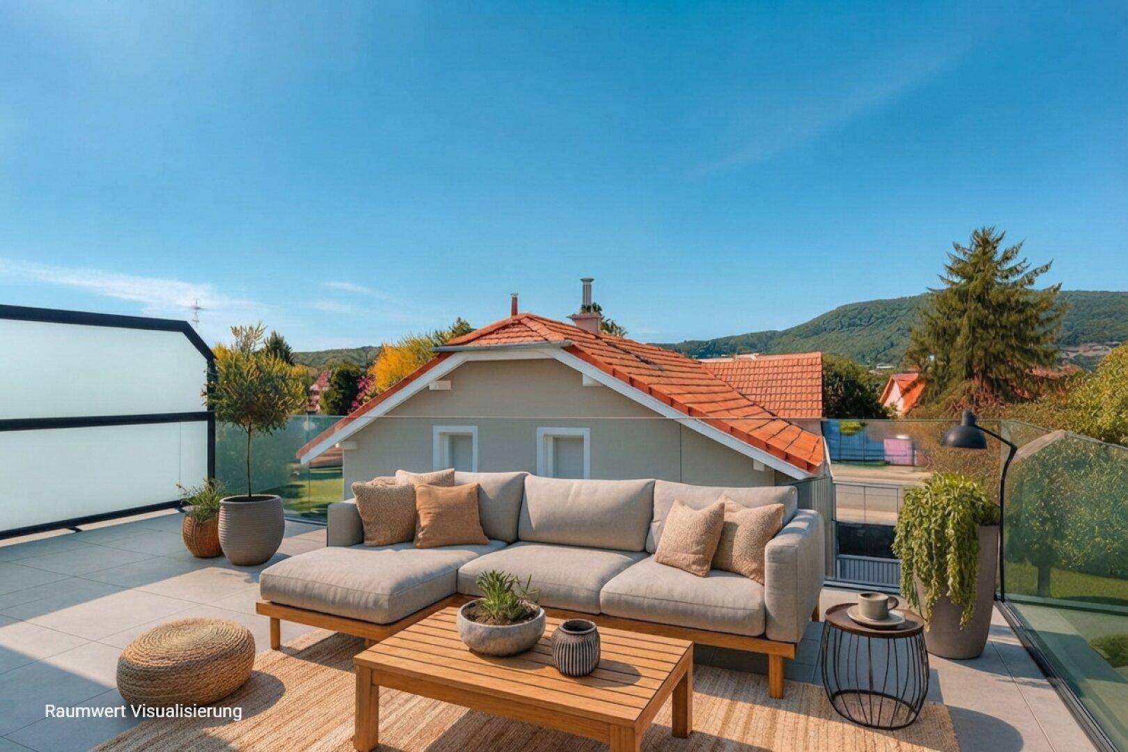 Geräumige Dachterrasse mit bequemen Loungemöbeln und weitem Blick in die Landschaft.