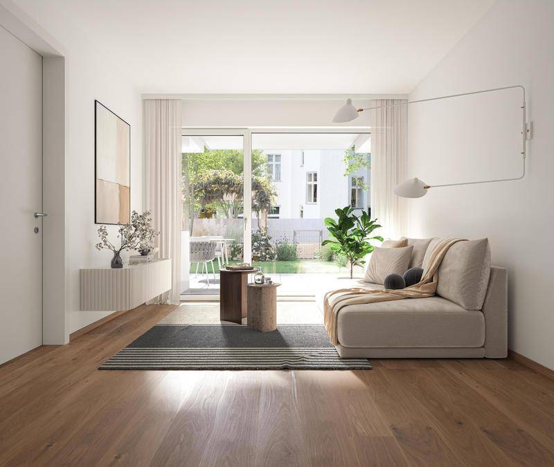 Gemütliches Wohnzimmer mit Holzboden und direktem Zugang zu einem kleinen Gartenbereich.