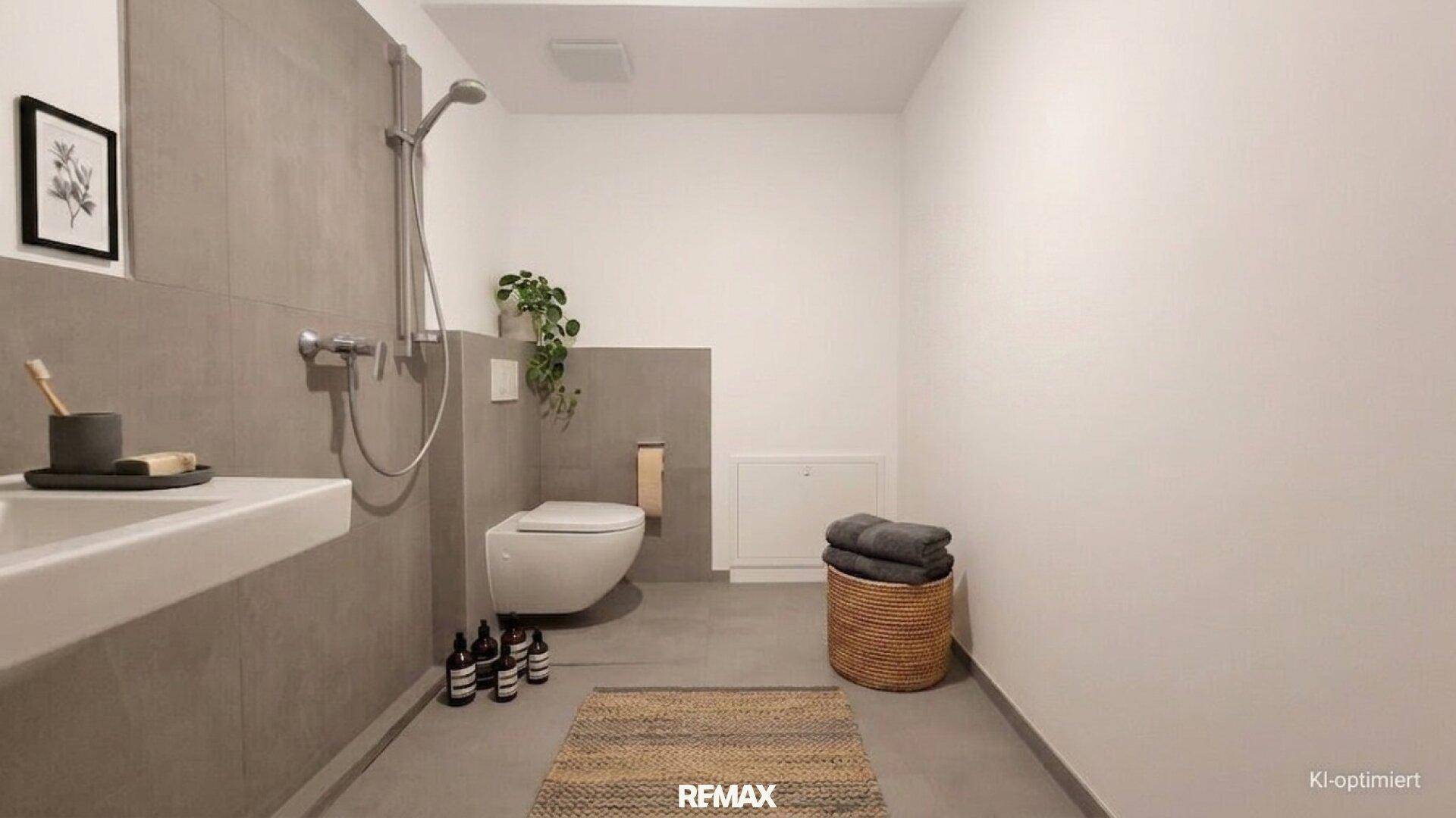 Modernes Badezimmer mit begehbarer Dusche, Wand-WC und grauen Fliesen.